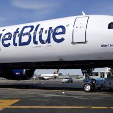 A picture of the slide of a plane with JetBlue written on it