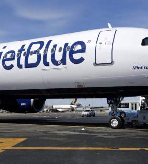 A picture of the slide of a plane with JetBlue written on it