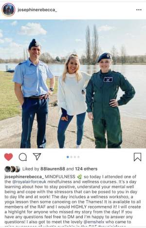 Three people standing in front of a lack. A man and a women are dressed in Royal Airforce uniform. 