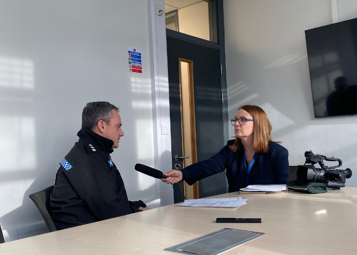 Man being interviewed by a woman