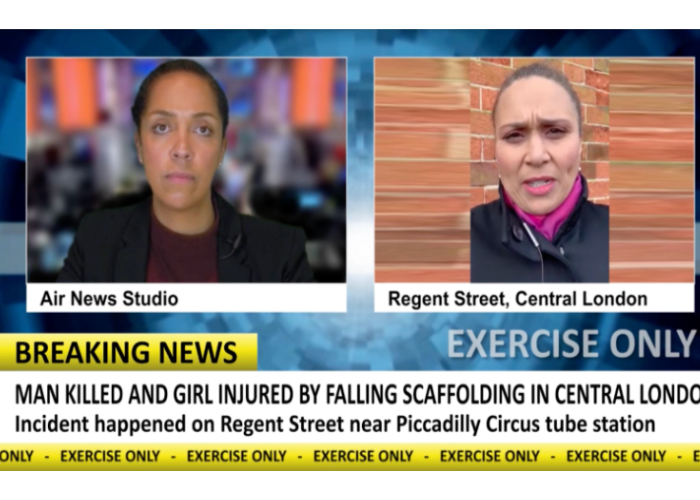 Two women journalists on screen